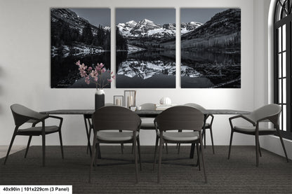a black and white photo of a dining room table