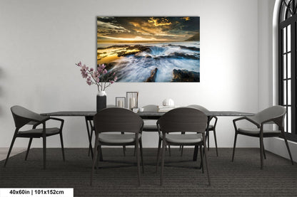 a dining room table with chairs and a painting on the wall