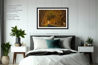 a bedroom with a bed and a picture hanging on the wall
