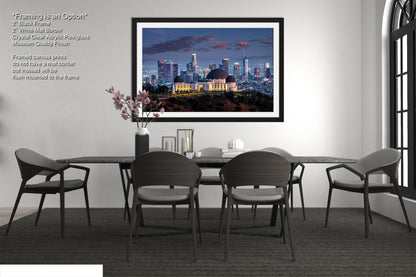 a dining room with a picture of a city skyline