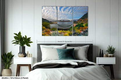 a bedroom with a bed and a painting on the wall
