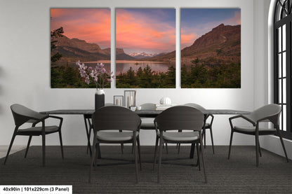 a dining room table with four chairs and a painting on the wall