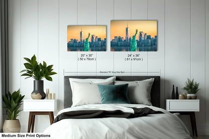 a bedroom with a bed and two pictures on the wall