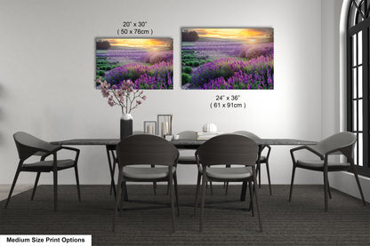 a dining room table with four chairs and a vase of flowers