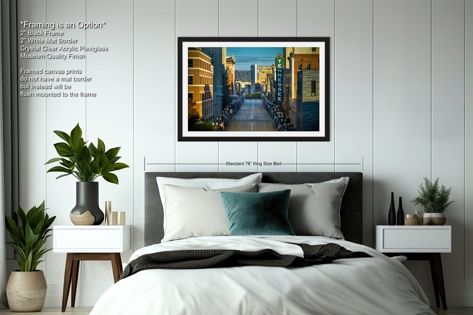 a bedroom with a large bed and a picture on the wall