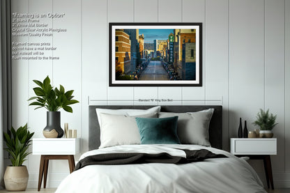 a bedroom with a large bed and a picture on the wall