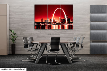 a dining room table with chairs and a picture of the st louis skyline