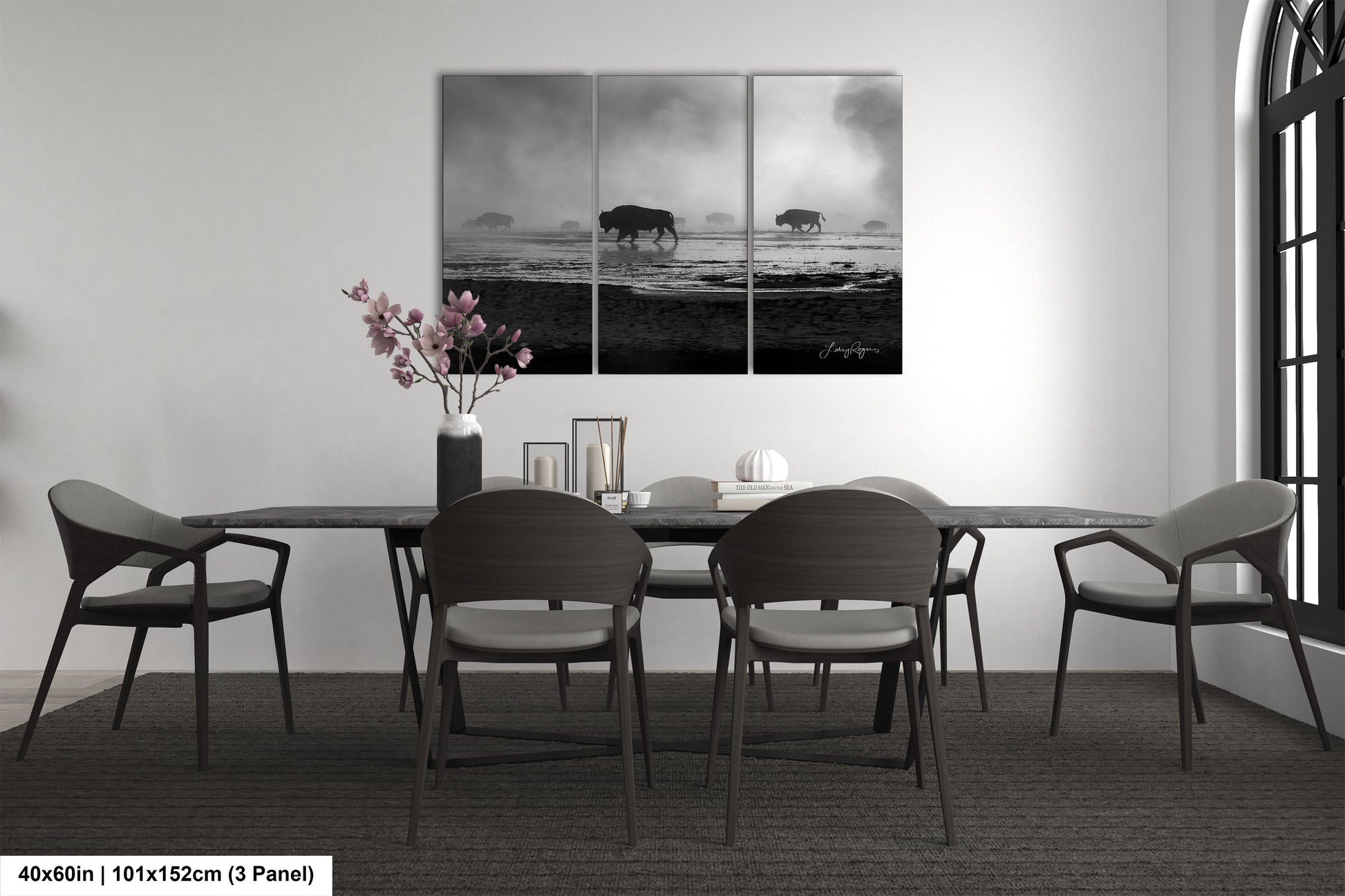 a black and white photo of a dining room table