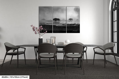 a black and white photo of a dining room table
