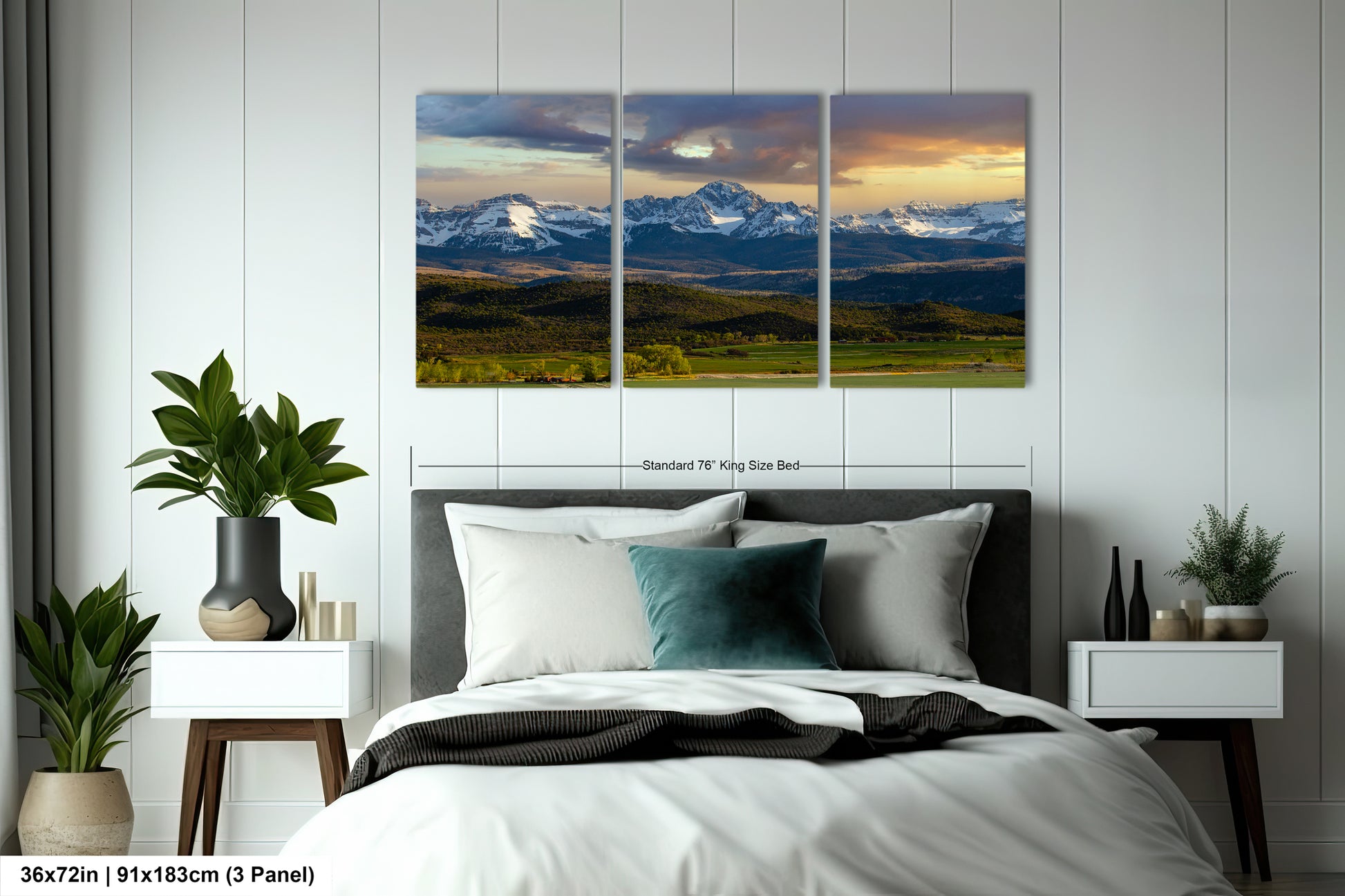 A bedroom with a large, three-panel landscape painting hanging on the wall above a bed. The painting depicts a scenic mountain landscape with snow-capped peaks and a colorful sky.