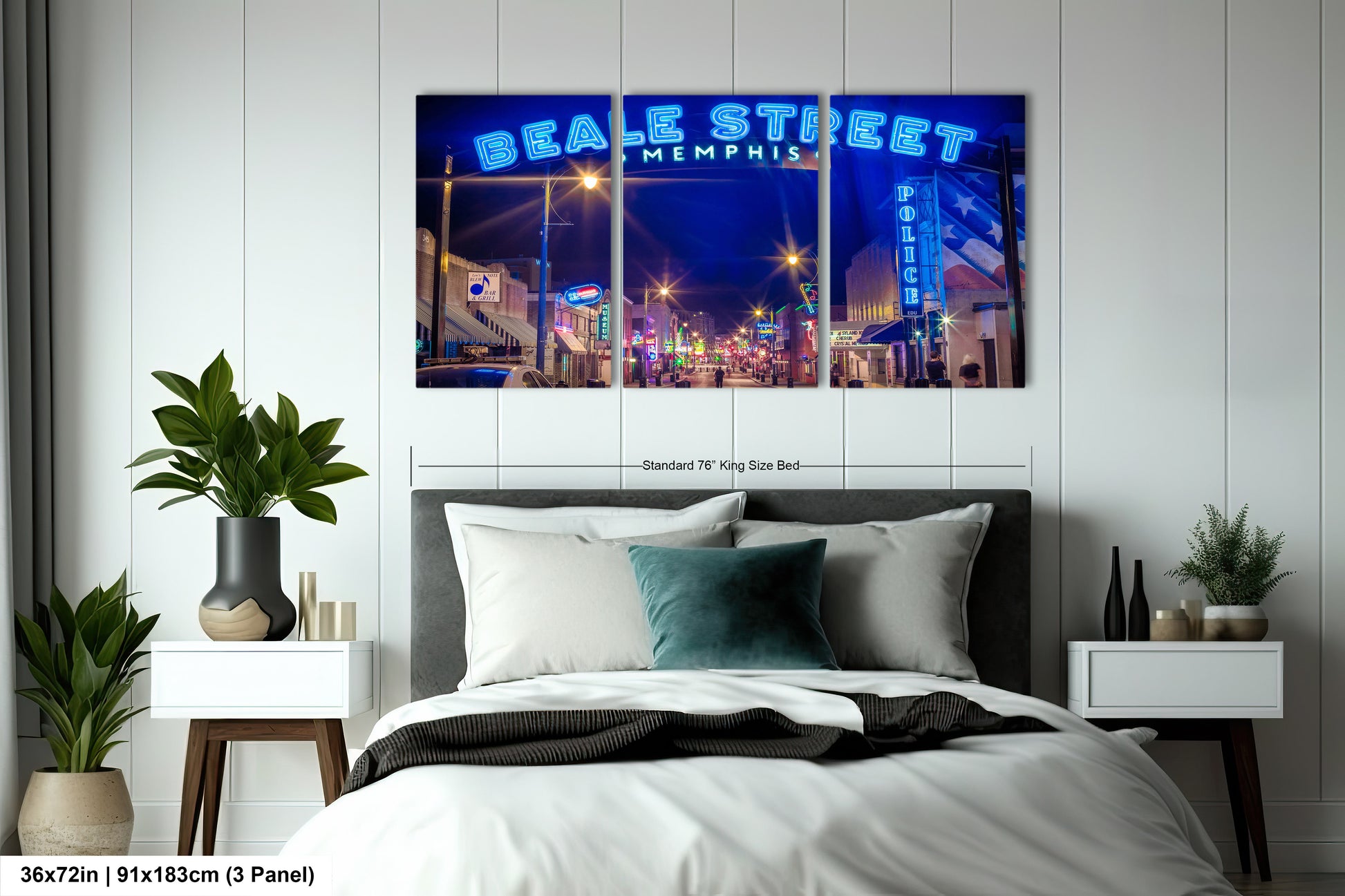 a bed room with a neatly made bed and a night scene