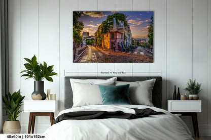 a bedroom with a bed and a painting on the wall