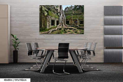 a room with a table and chairs and a painting on the wall