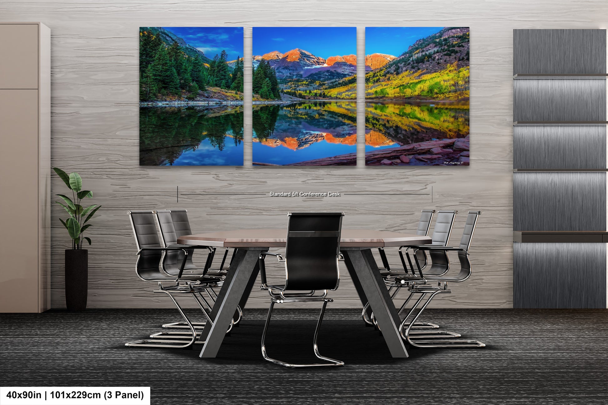 a dining room table with chairs and a painting on the wall