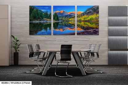 a dining room table with chairs and a painting on the wall