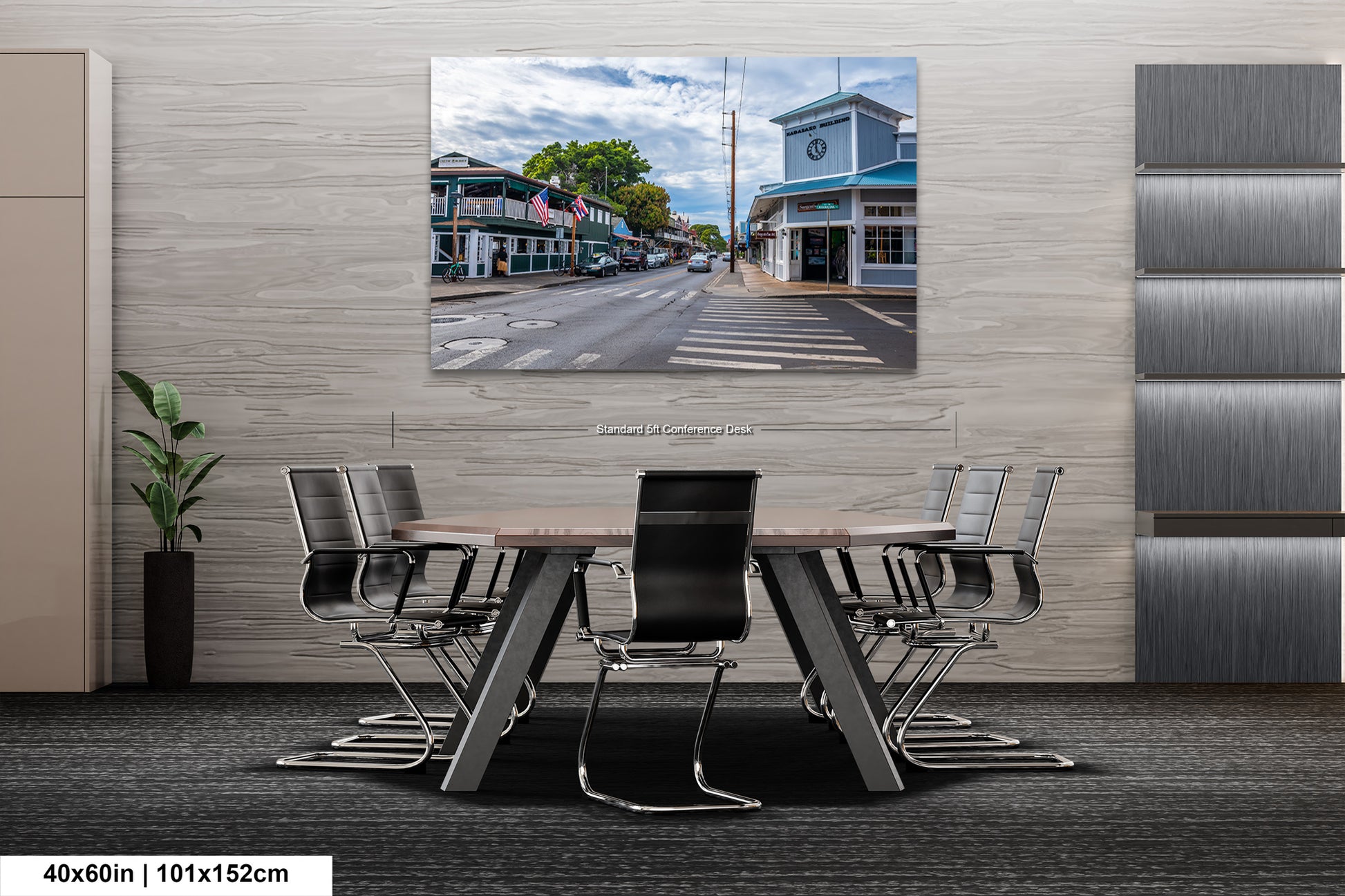 a dining room table with chairs and a picture on the wall