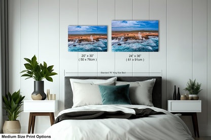 a bed room with a neatly made bed and two pictures on the wall