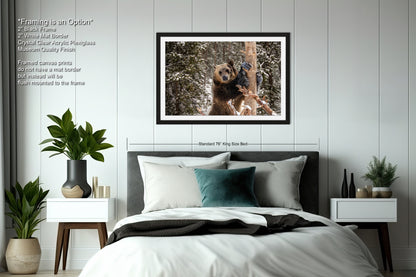 a bed with a picture of a dog hanging above it