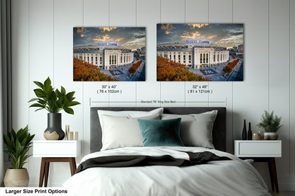 a bedroom with a bed and two pictures on the wall