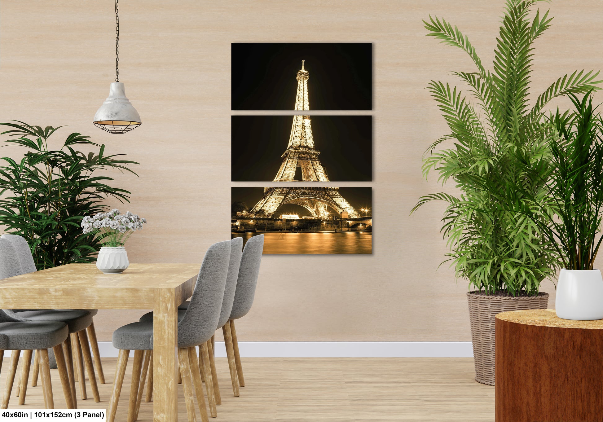 a room with a table and chairs and a picture of the eiffel tower