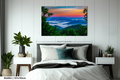 a bedroom with a bed and a painting on the wall