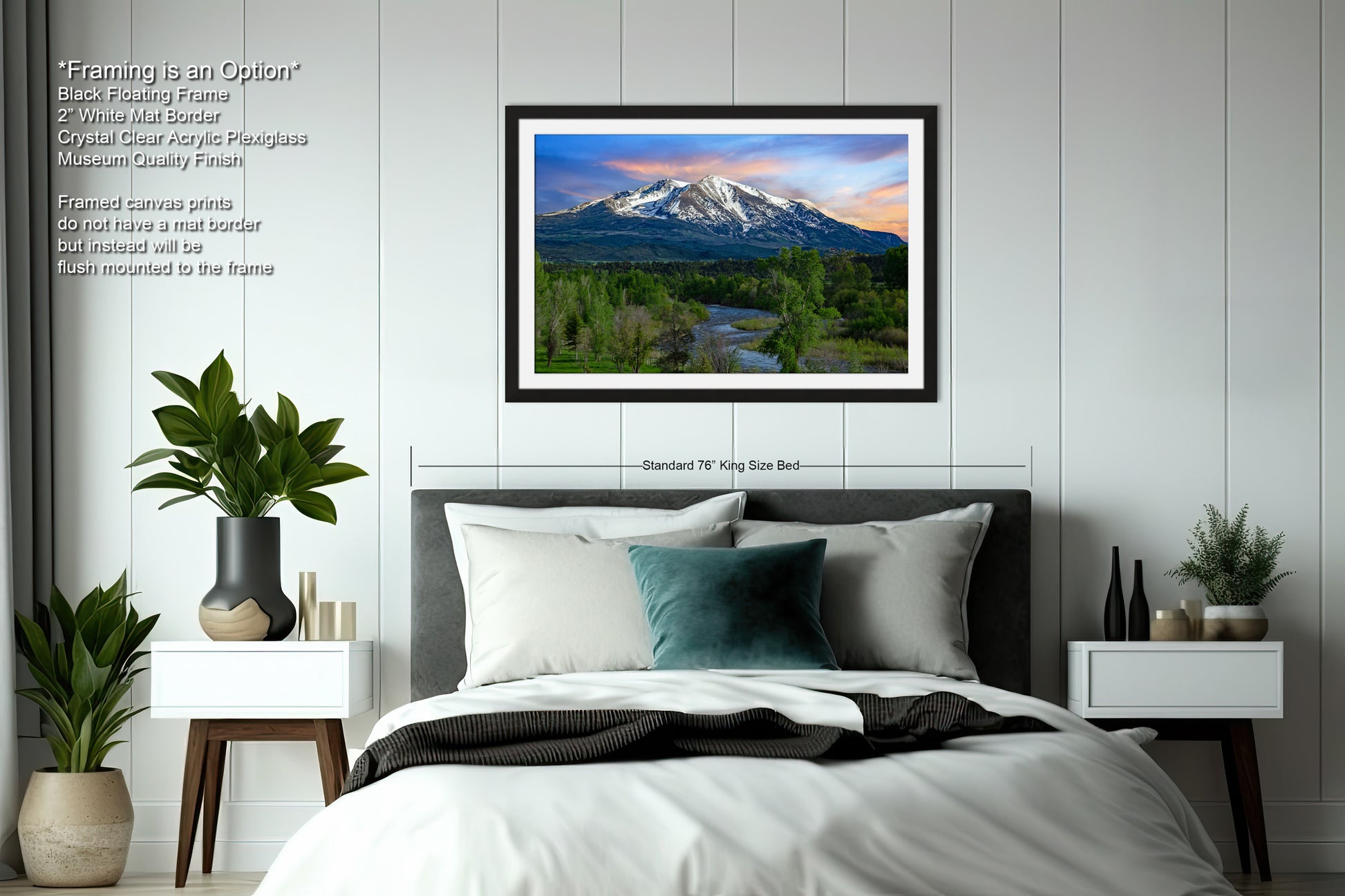 a bedroom with a bed and a picture hanging on the wall