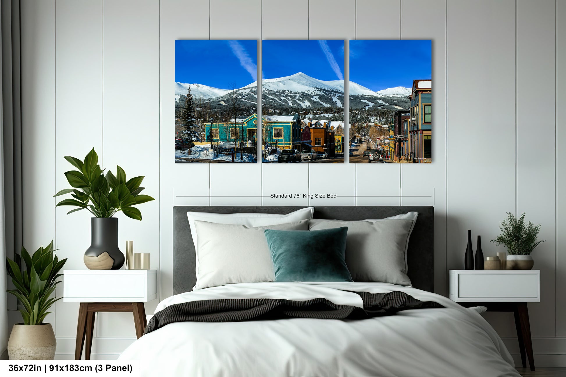 a bed room with a neatly made bed and two pictures on the wall