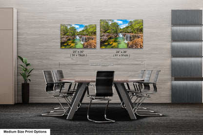 a dining room table with chairs and a picture of a waterfall