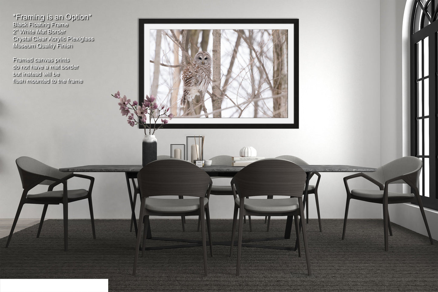 a dining room table with chairs and a vase of flowers