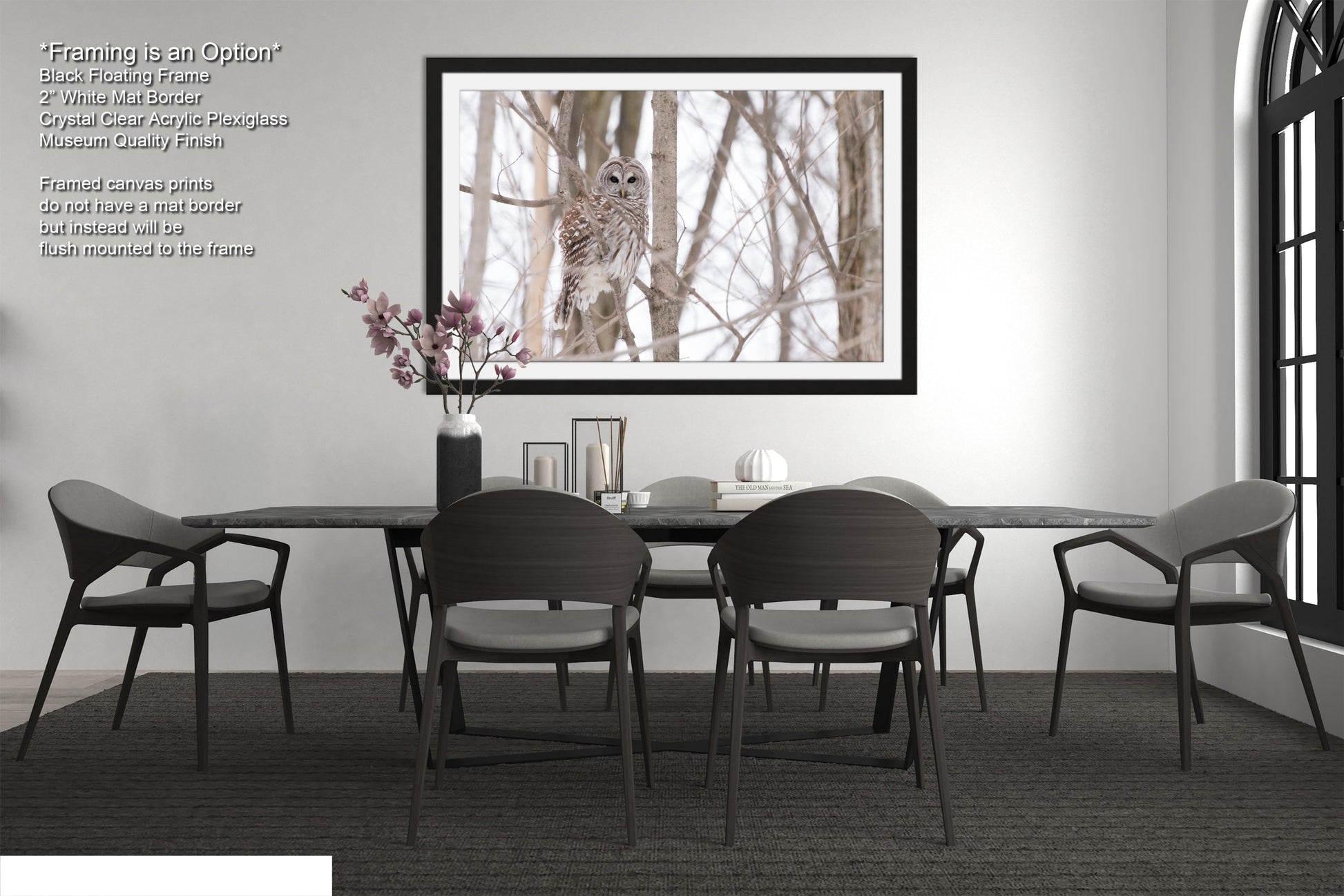 a dining room table with chairs and a vase of flowers