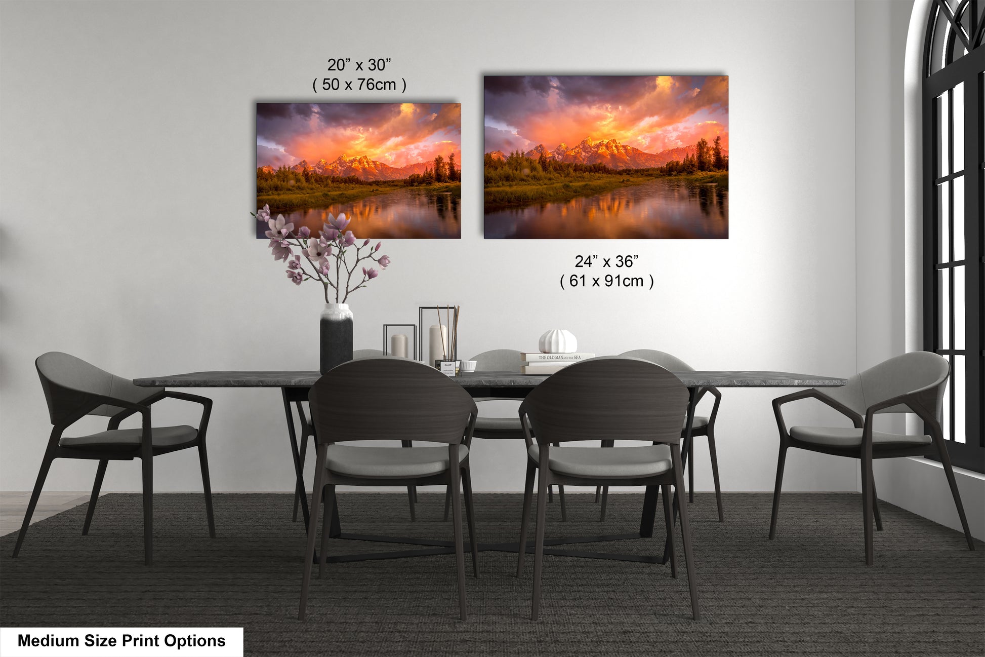 a dining room table with chairs and a painting on the wall