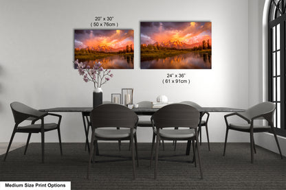 a dining room table with chairs and a painting on the wall