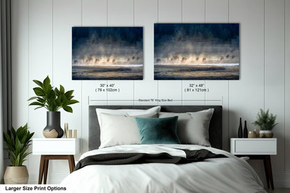 a bedroom with a bed and two pictures on the wall