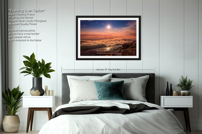 a bedroom with a bed and a picture on the wall