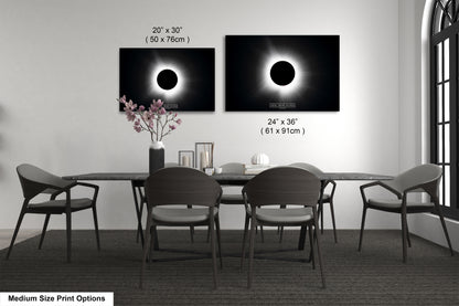 a dining room table with chairs and a vase of flowers