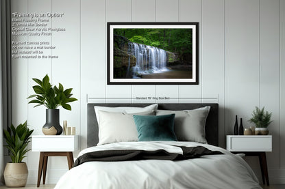 a bedroom with a bed and a picture of a waterfall