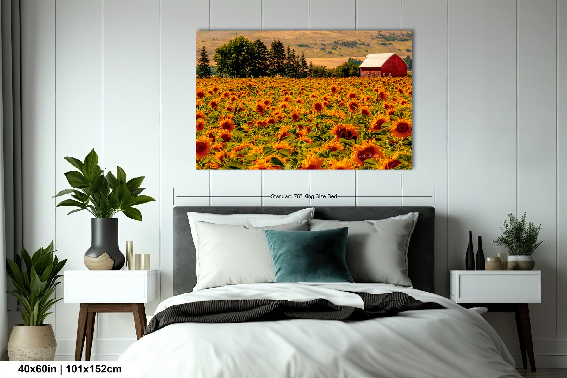 a bed room with a neatly made bed and a painting on the wall
