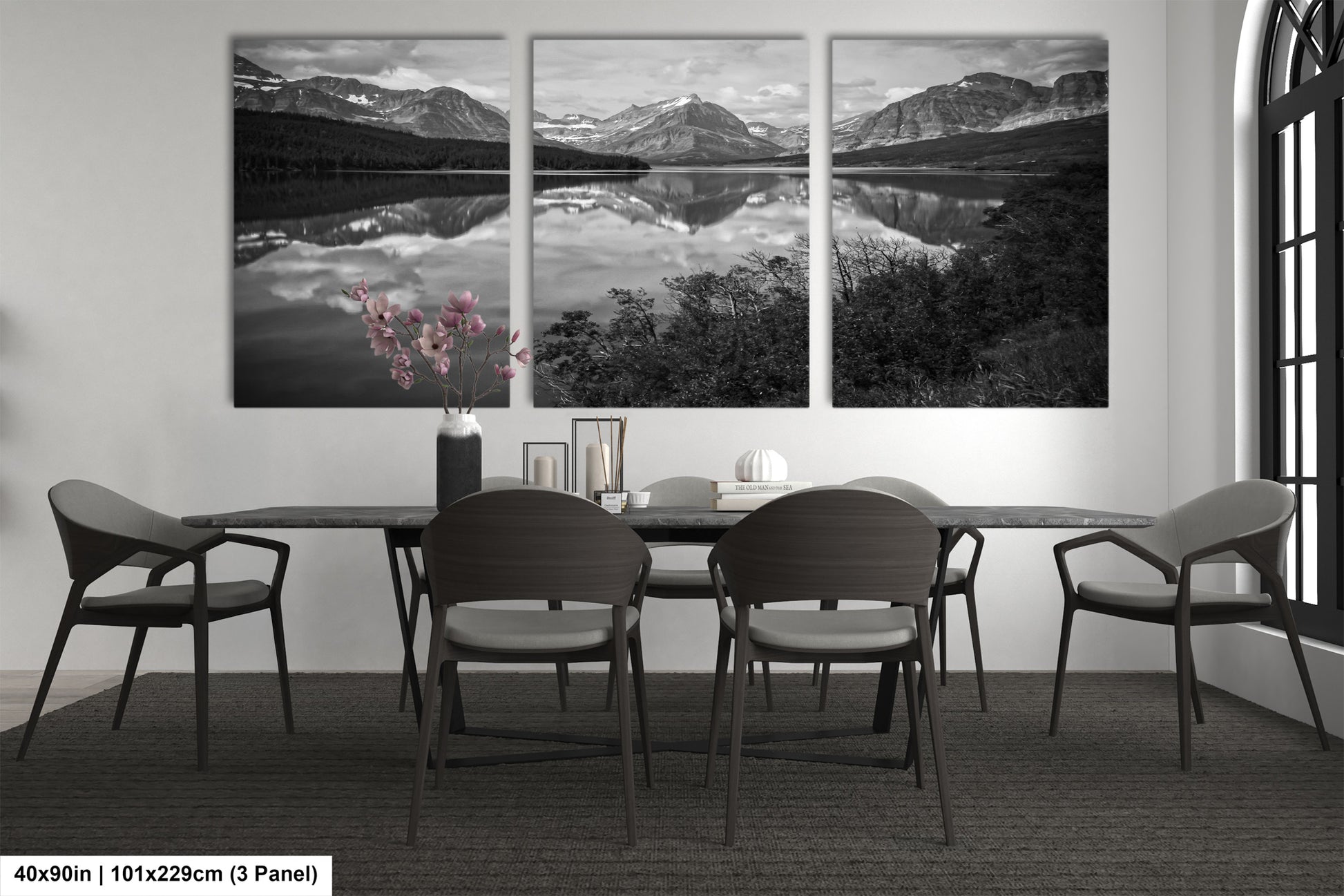 a black and white photo of a dining room table