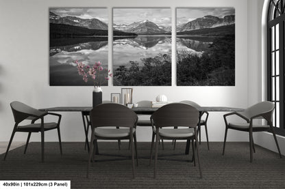 a black and white photo of a dining room table