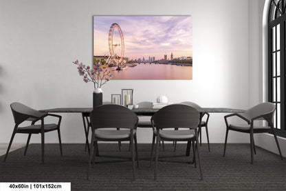 a dining room table with chairs and a painting on the wall