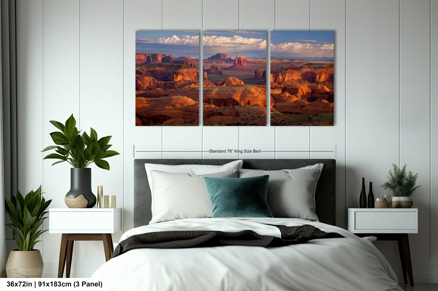 a bed room with a neatly made bed and three pictures on the wall