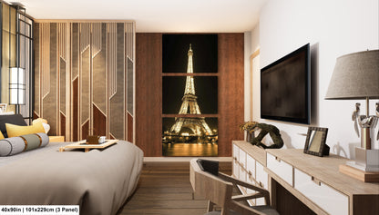 a room with a bed, desk, television and a window with the eiff