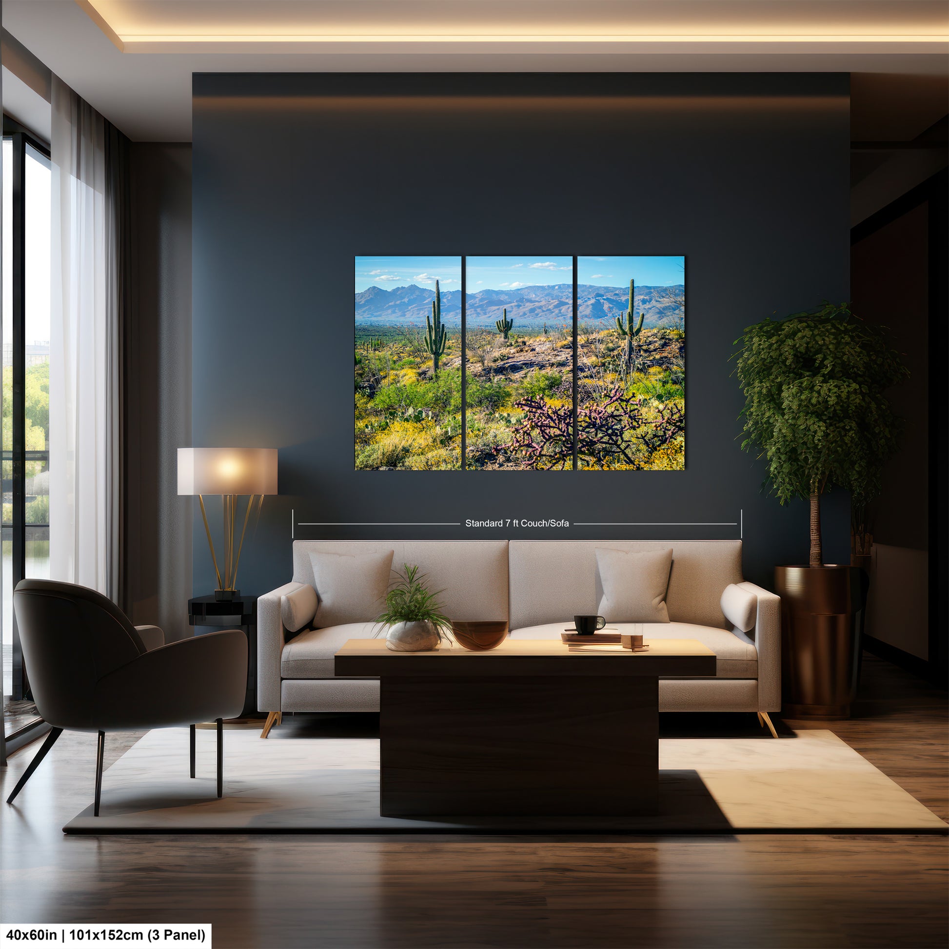 a modern living room with a large, three-panel landscape painting of a desert scene hanging on the wall. The painting features a desert landscape with mountains in the background and a cactus in the foreground. The room is furnished with a sofa, a coffee table, and a potted plant, creating a cozy and inviting atmosphere.