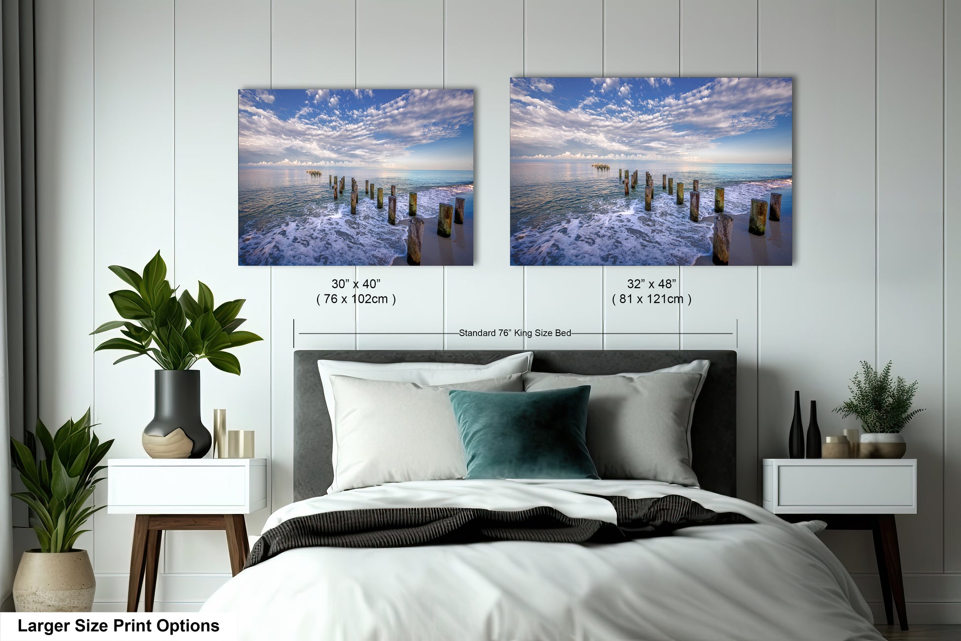 a bed with two pictures hanging on the wall above it