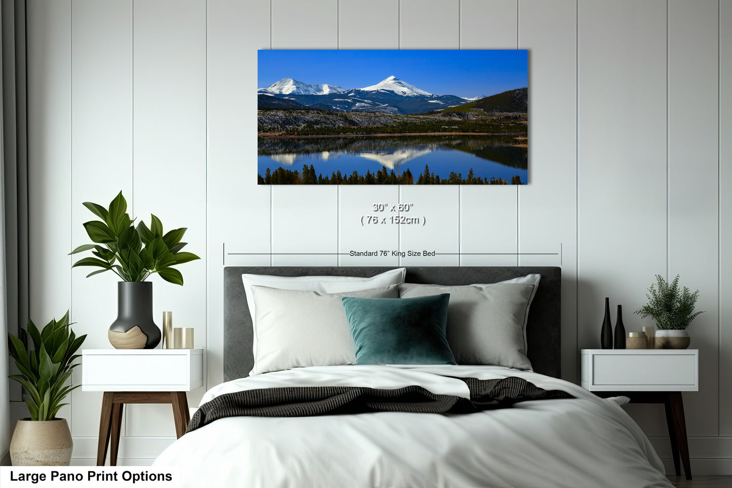 a bedroom with a large bed and a painting on the wall