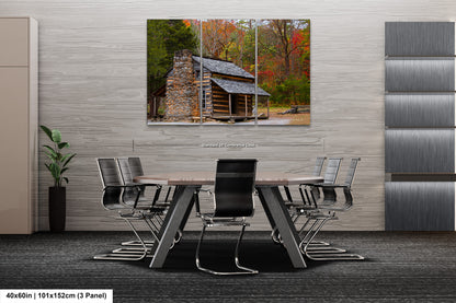 a table and chairs in a room with a painting on the wall