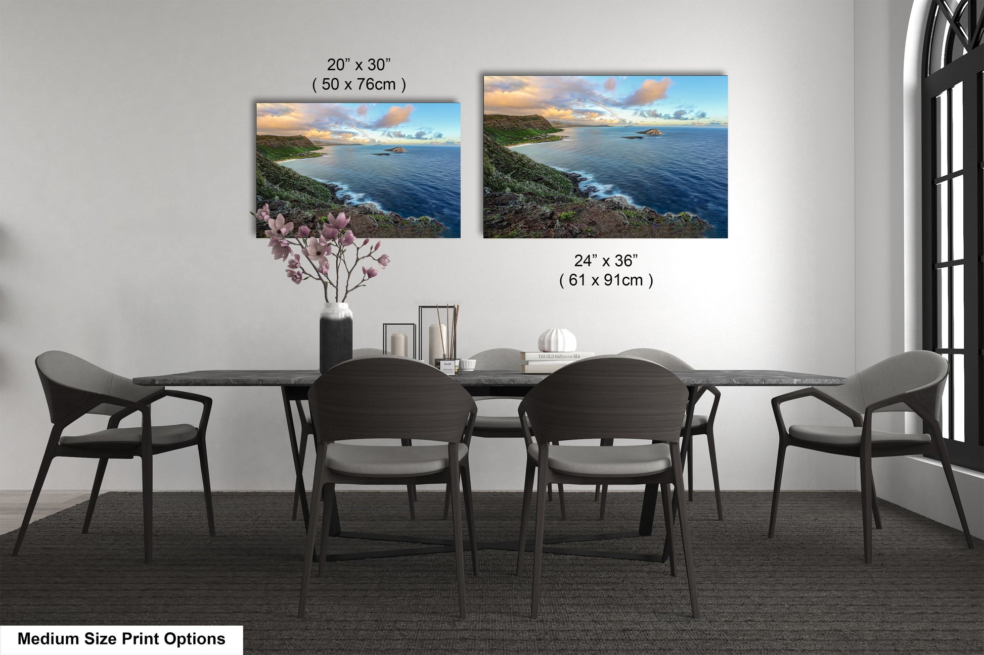 a dining room table with four chairs and a vase of flowers