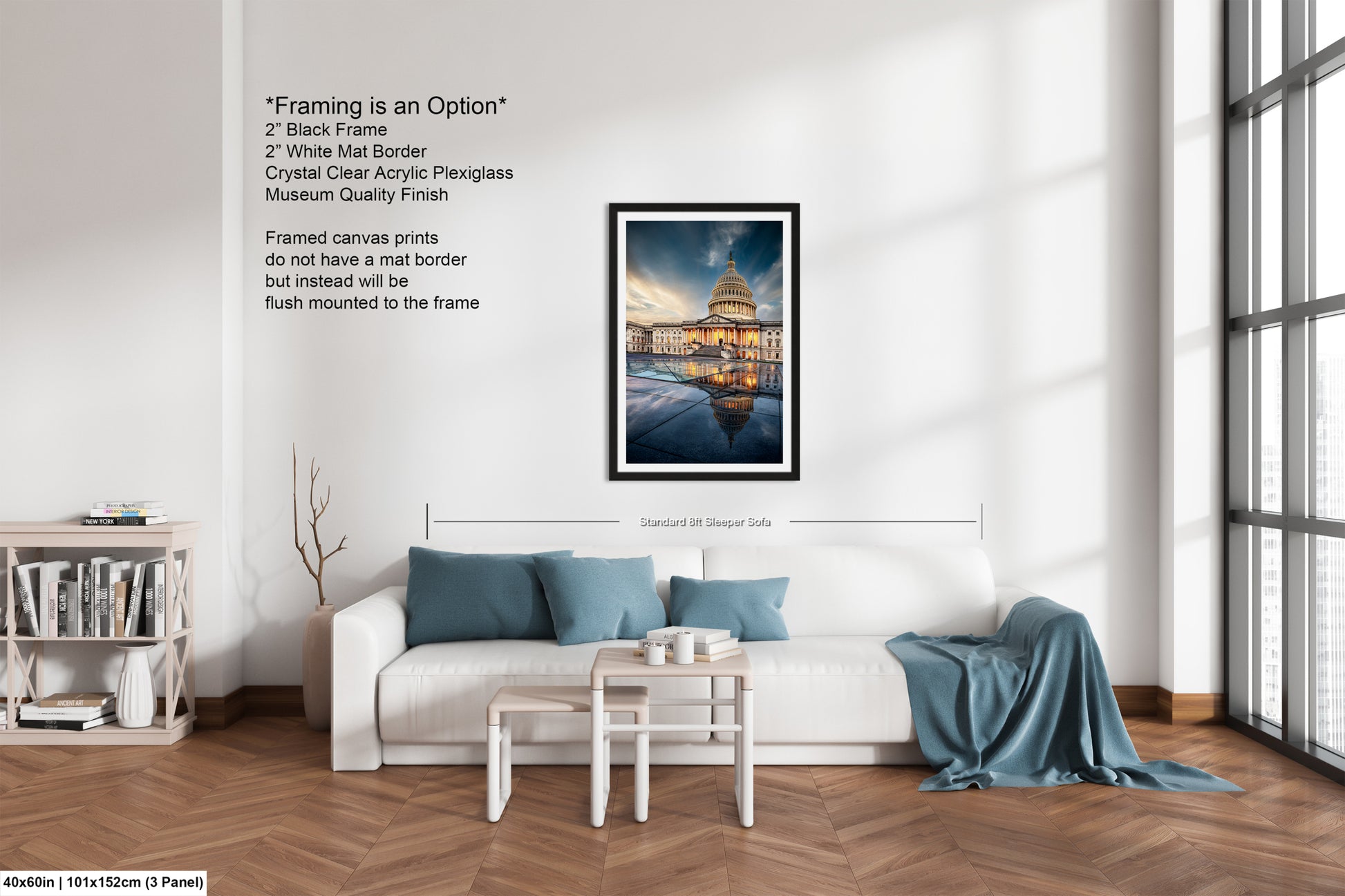 a living room with a white couch and a painting on the wall