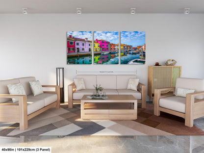 a living room filled with furniture and a painting on the wall