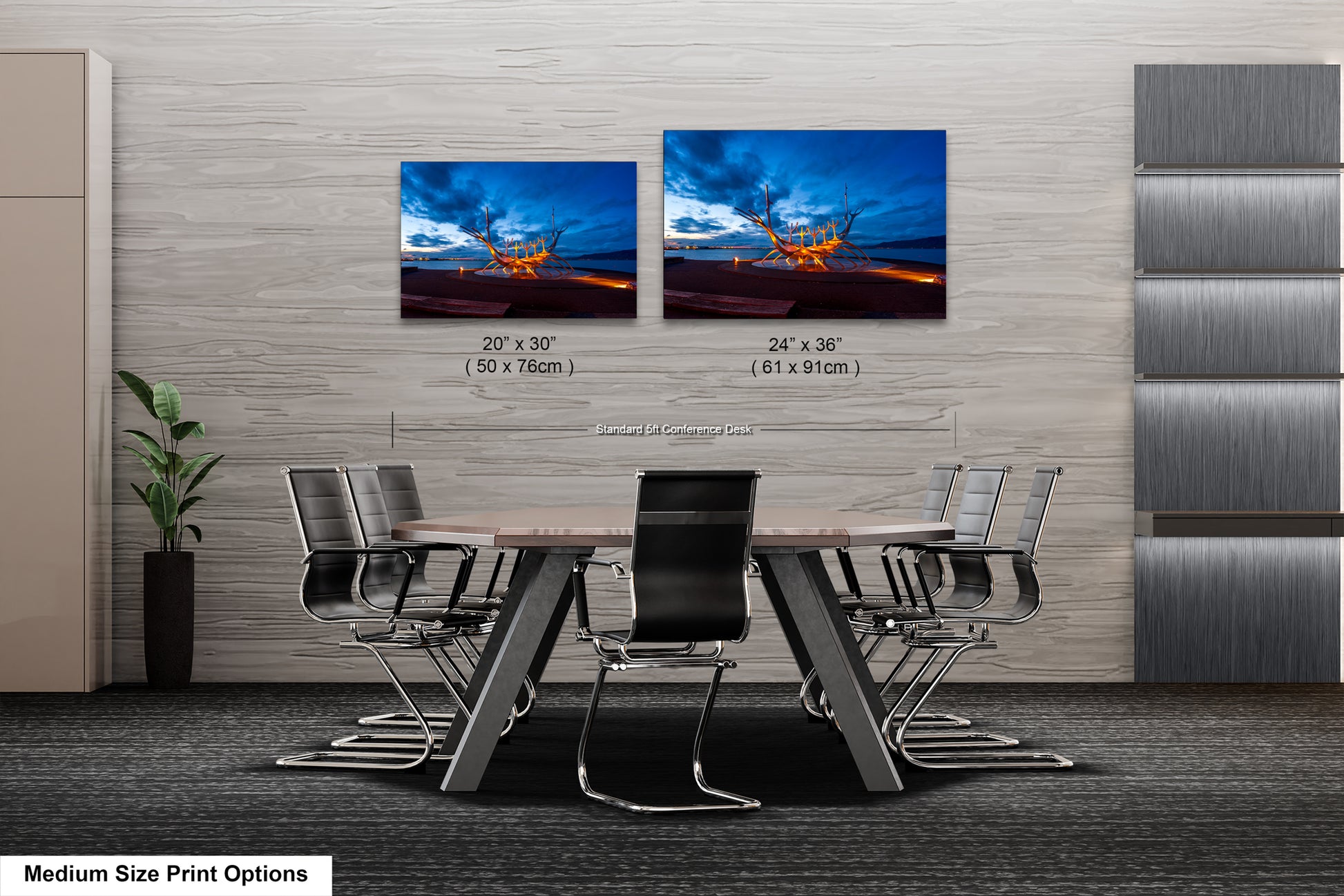 a dining room table with chairs and two pictures on the wall